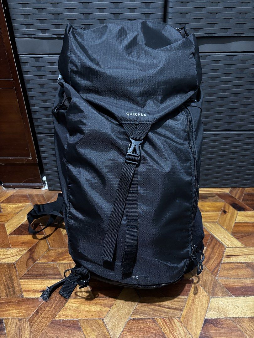 Quechua MH100 35L Backpack (Category: Backpacks) located in Guiguinto. Submitted by drlsaldi (Listing ID 1421911582, Image 1). Description: - Quechua 35L backpack but can expand upto 38-40L - Color: Black - Closure: Top flap with buckle and side zipper - Has adjustable straps - Includes side pockets - Has padded back support and waistband - Originally priced at 2,300 RFS: buying different style of travel backpack.