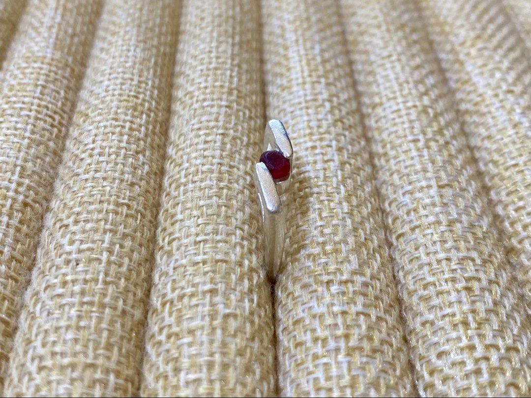 Sculptural Ring with round-cut ruby gemstone | S925 (Category: Rings) located in Solano. Submitted by silvershineph (Listing ID 1421857464, Image 2). Description: ✧ Product / Item Name: Sculptural Ring with round-cut ruby gemstone ✧ Description: The ring has a modern, sculptural, or bypass-style band where the metal ends wrap around or “embrace” the center stone. ✧ Size: 5-5.5 ✧ Weight: 3.9g ✧ Details: • Genuine silver • Carefully inspected quali