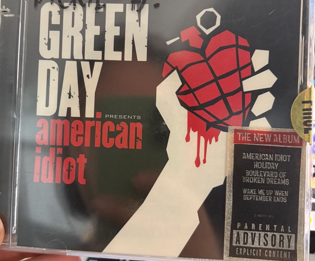 SEALED & PRELOVED: Green Day CD Albums (Category: CDs & DVDs) located in Makati City. Submitted by spinnerhoundrecords (Listing ID 1421858401, Image 2). Description: Price starts at 250 pesos. Refer to the list below for the exact price and condition of each item. Warning - VG++ - 250 pesos American Idiot w/ hype sticker, damaged case (left side) - SEALED - 250 pesos American Idiot w/ VCD, damaged case (left side) - SEALED - 300 pesos Father of A