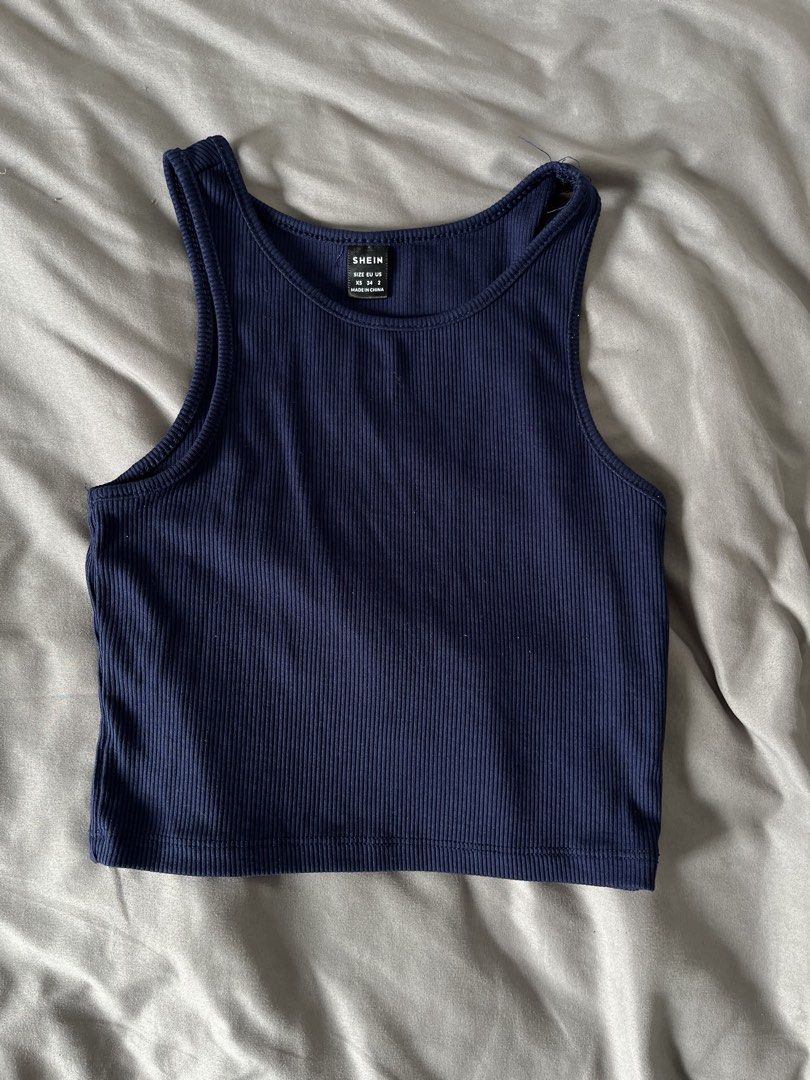 Shein Ribbed Tank Top - Navy Blue (Category: Sleeveless) located in Mandaluyong City. Submitted by leilei06 (Listing ID 1421905915, Image 1). Description: - Shein navy blue ribbed tank top - Size: XS - Color: Navy blue - Features: Scoop neck, sleeveless - Style: Casual - Fabric: Ribbed - Used once.