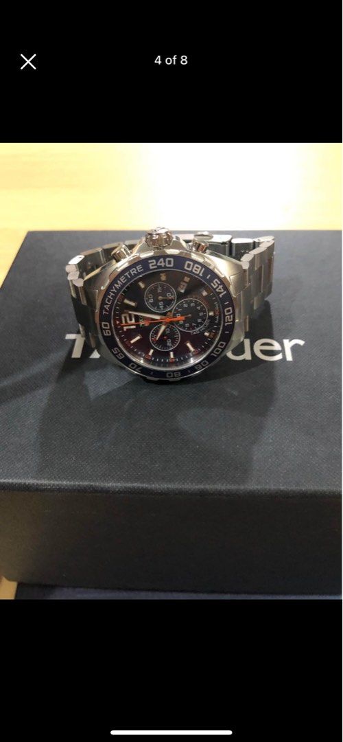 Tag Heuer Formula 1 Chronograph Quartz Watch (Category: Men's Watches) located in Quezon City. Submitted by flacko07 (Listing ID 1421920802, Image 3). Description: Authentic Tag Heuer Formula 1 quartz chronograph watch. Features a stainless steel bracelet and a blue bezel. Comes with the original box, papers, and a Tag Heuer cap. The watch has a blue dial with chronograph subdials. The back of the watch has a detailed design. Includes a Tag Heuer