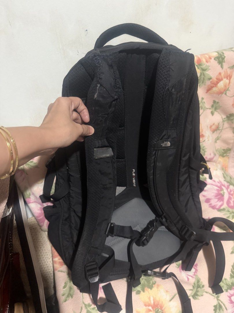 The North face router transit backpack (Category: Backpacks) located in San Pablo. Submitted by prelovedbymistyblue (Listing ID 1421904468, Image 2). Description: Original TNF backpack. With 3 major compartment (1 for laptop) and 2 small front pocket. The 2 open side pocket are quite loose. With holo sticker. The back strap was already sewn manually due to use. You may have it repaired at a bag repair shop like Mr quickie. Measures 14 x 17.5 x 7 