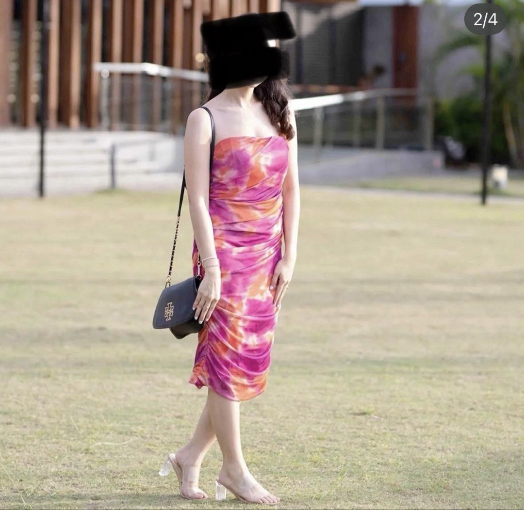 Tie-dye Ruched Midi Dress (Category: Dresses) located in Cainta. Submitted by laazzz (Listing ID 1421617352, Image 2). Description: - Tie-dye midi dress - Pink and orange colors - Strapless design - Ruched texture - Form-fitting silhouette - Lightweight fabric - Ideal for summer or night out.