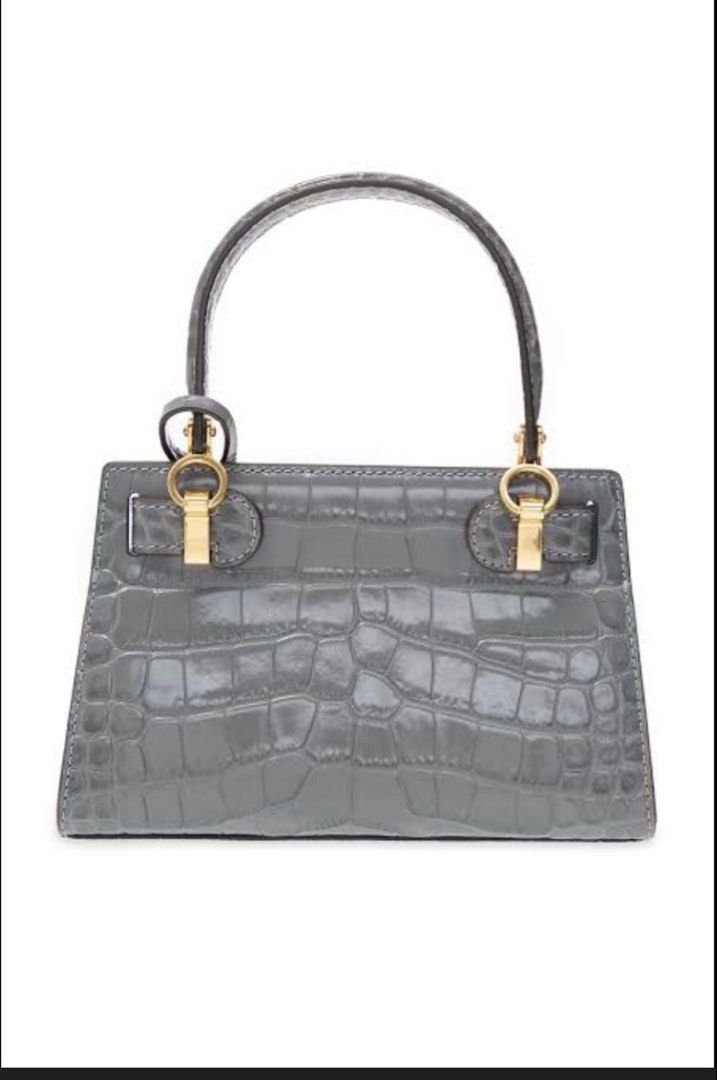 Tory Burch Lee Radziwill Shoulder Bag (Category: Luxury Bags & Wallets) located in Quezon City. Submitted by ___r. (Listing ID 1421805868, Image 3). Description: - Tory Burch Lee Radziwill Shoulder Bag - Color: Grey - Exterior: Croc-embossed leather - Features: Top handle, detachable crossbody strap - Hardware: Signature lock-and-key - Interior: Card slot - Includes: Dust bag - Design: Structured silhouette.