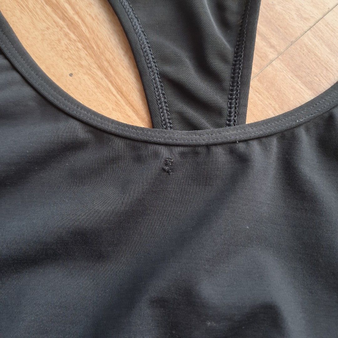 Victoria's Secret PINK Ultimate Sports Bra in black featuring the signature dog logo (Category: Activewear) located in Digos. Submitted by richcaliforniaclothingstore (Listing ID 1421845851, Image 3). Description: ○ Color may vary due to lighting. Size: L on tag This sports bra is designed for low to medium-impact activities, making it a versatile choice for both exercise and daily wear..