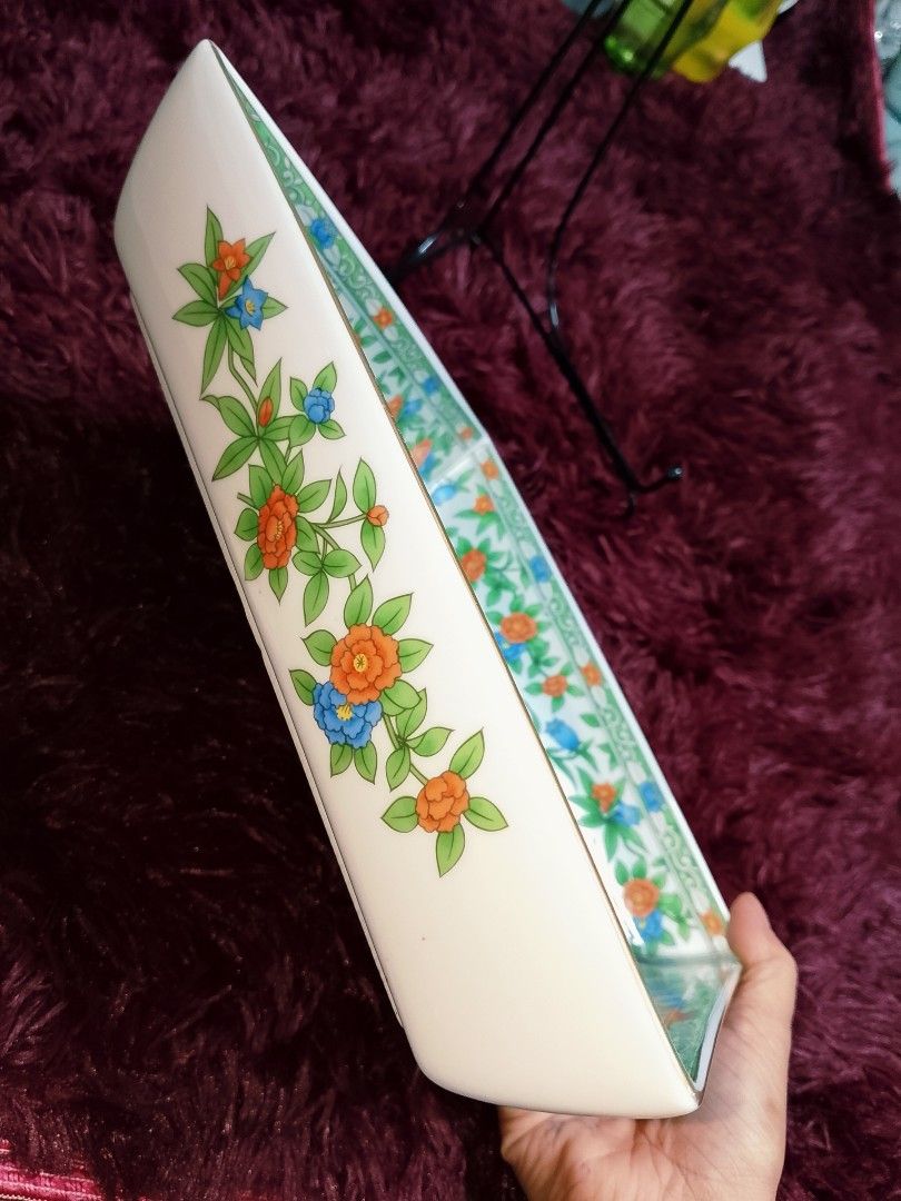 Vintage Floral Square Serving Dish (Category: Dinnerware & Cutlery) located in Cabanatuan. Submitted by miss.maia (Listing ID 1421853962, Image 2). Description: - Square serving dish - Floral design: white base with orange and blue flowers, green leaves, and gold trim - Dimensions: 20cm x 20cm - Features a blue stamp on the bottom.