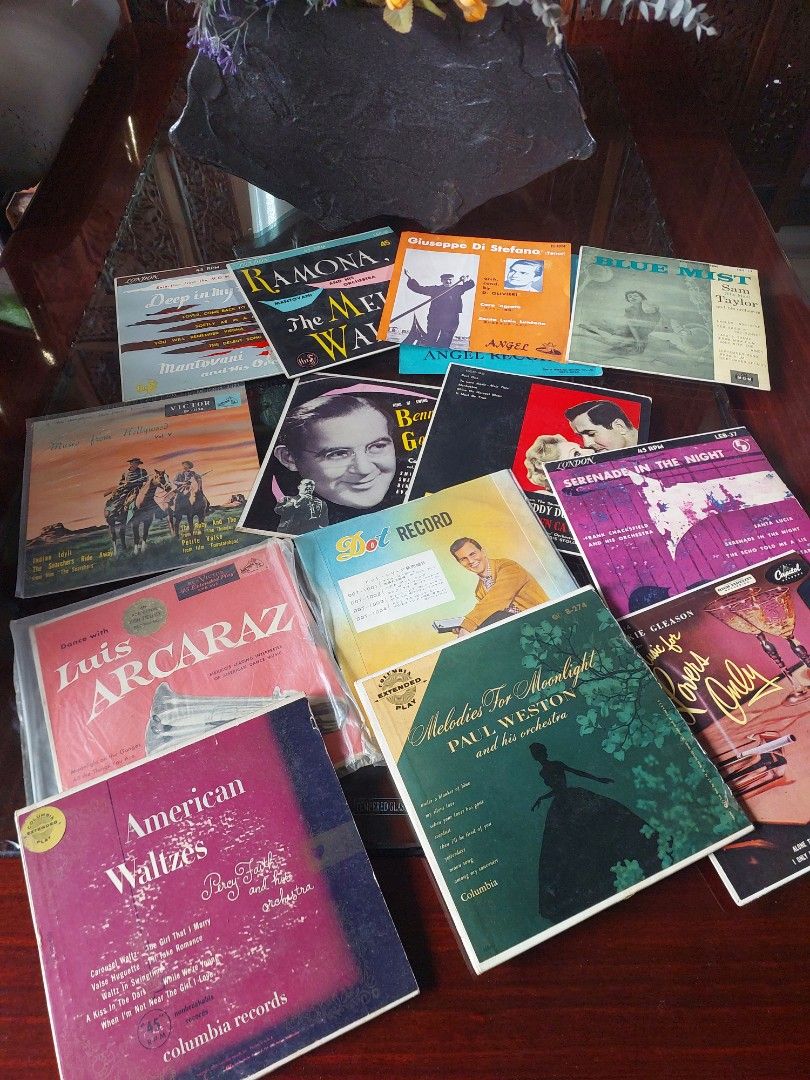 Vintage Vinyl Record Collection (Category: Vinyls) located in Bulacan. Submitted by hnbfinds (Listing ID 1421818448, Image 3). Description: Take all A collection of vintage music items features several 45 RPM vinyl records, which are collectible items popular in the mid-20th century. Artists: The collection includes records by Benny Goodman, a renowned jazz musician, and Mantovani, a popular easy-listening orchestra conductor. Content: The record