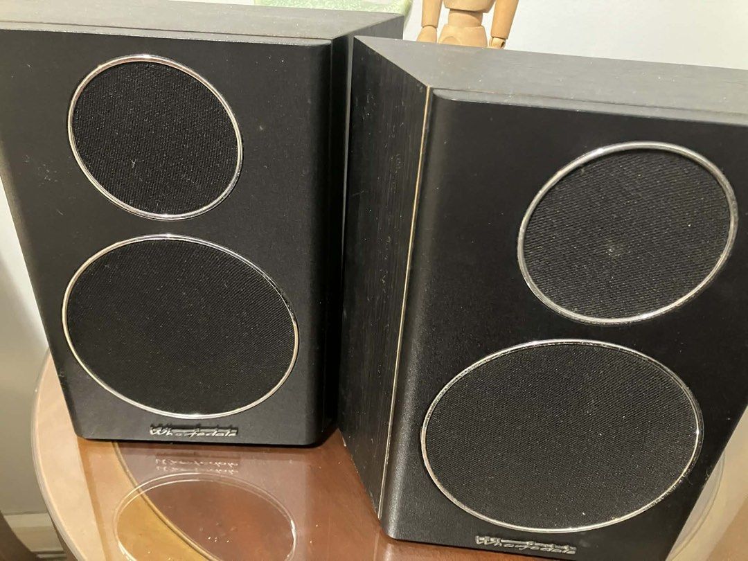 Wharfedale WH-SR1 Speakers (Category: Soundbars, Speakers & Amplifiers) located in Paranaque City. Submitted by jrebamontaaaan (Listing ID 1421800355, Image 1). Description: The Wharfedale WH-SR1 speakers boast a sleek black finish with silver trim that accentuates the speaker cones. These speakers come with convenient mounting brackets on the back for installation. They have a 6-ohm impedance, a 10-80W amplifier power rating, and an impressive 8