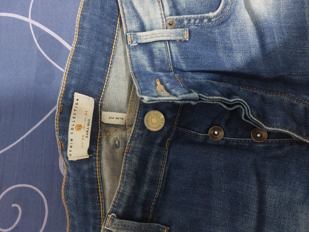 Zara Denim Collection Slim Fit Jeans (Category: Jeans) located in Lubao. Submitted by 23dang (Listing ID 1421836062, Image 2). Description: - Zara Denim slim fit jeans - Light blue wash - Distressed detailing - Classic five-pocket design - Button fly - Check size on label - Features a leather patch with logo - Stylish and comfortable -size 34.