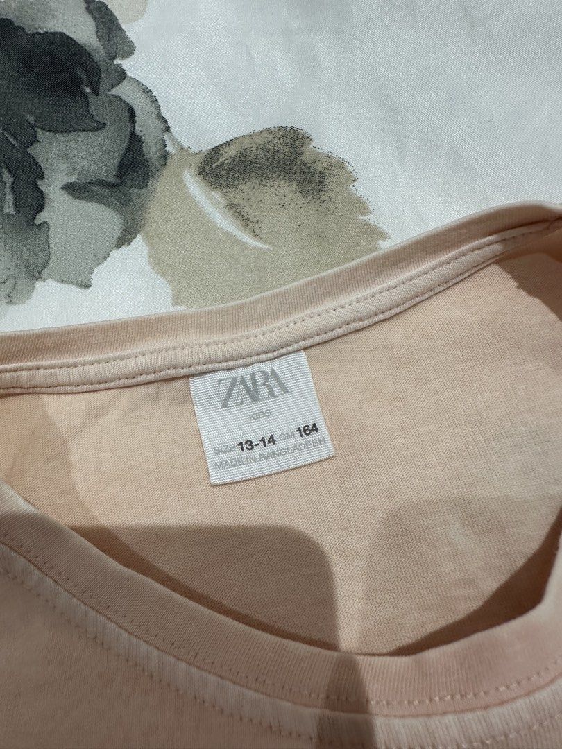 Zara Kids T-shirt (Category: Shirts) located in Quezon City. Submitted by timelessfinds (Listing ID 1421860559, Image 3). Description: -1 for ₱100, 2 for ₱150 - Zara Kids T-shirt - Size: 13-14 (164cm) - Available designs: "Chicago Lover 1990" or "one day in New York" - Comfortable material - Stylish and trendy.