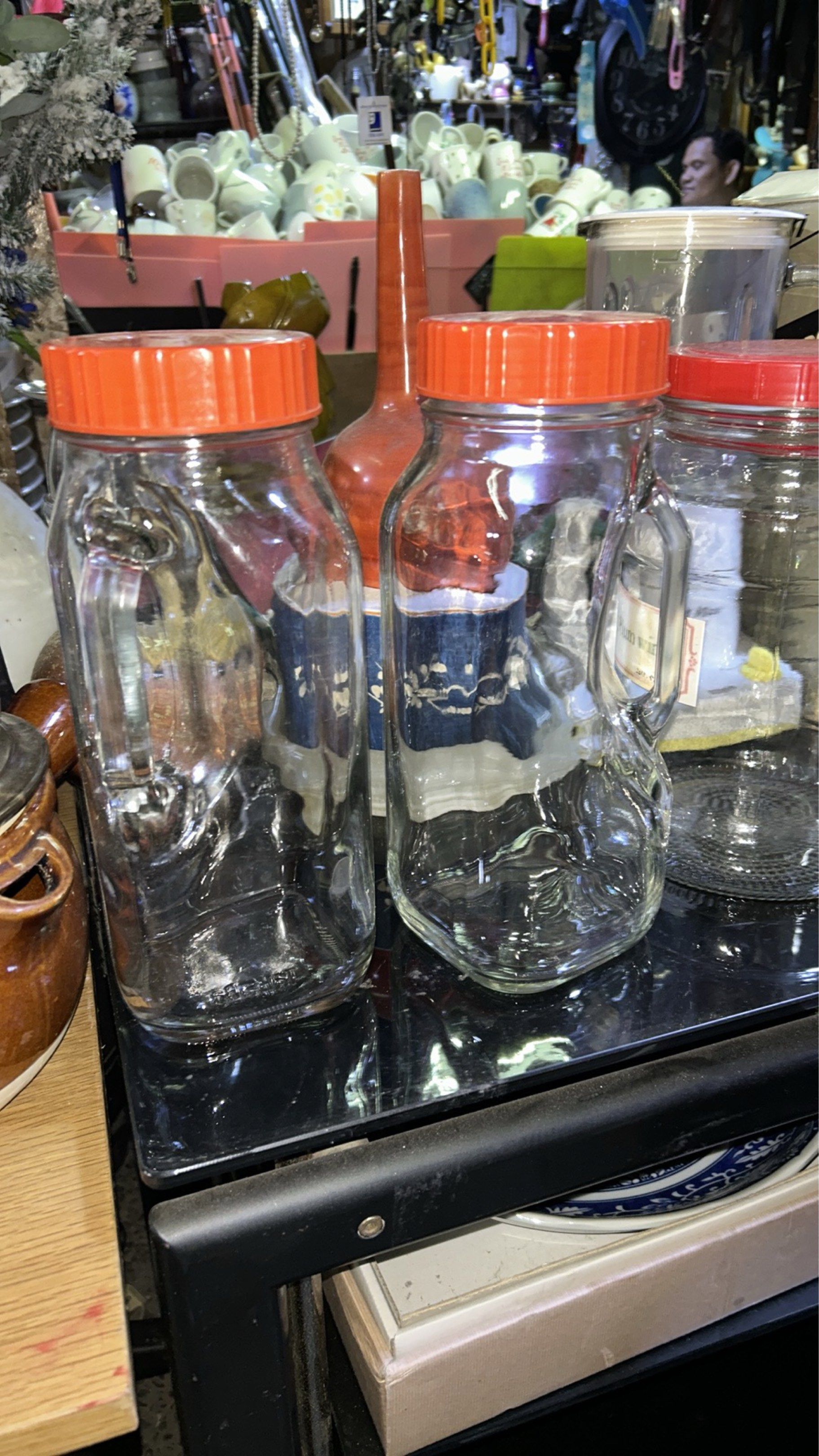 2 PC PAIR ELEGANT THICK GLASS JARS WITH GLASS SIDE HANDLE & LID (Category: Water Bottles & Tumblers) located in Valenzuela. Submitted by gregferraren (Listing ID 1421996901, Image 1). Description: 2 pcs Pair thick glass Unused like new P1380 Good for exquisite kitchen decor / snacks, nuts, chocolate munchies storage Good as water pitcher, juice, soda. Good as collectible item Sure buyer may inquire video/ charged real time delivery or shipping na