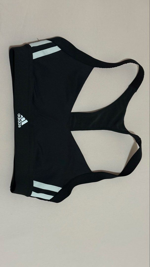 Adidas Sports Bra (Category: Activewear) located in Pasig City. Submitted by mphg37 (Listing ID 1422046683, Image 1). Description: - Adidas sports bra - White stripes - Racerback design - Adidas logo on front - Medium support - Comfortable, stretchy material - Ideal for running, yoga, and gym.