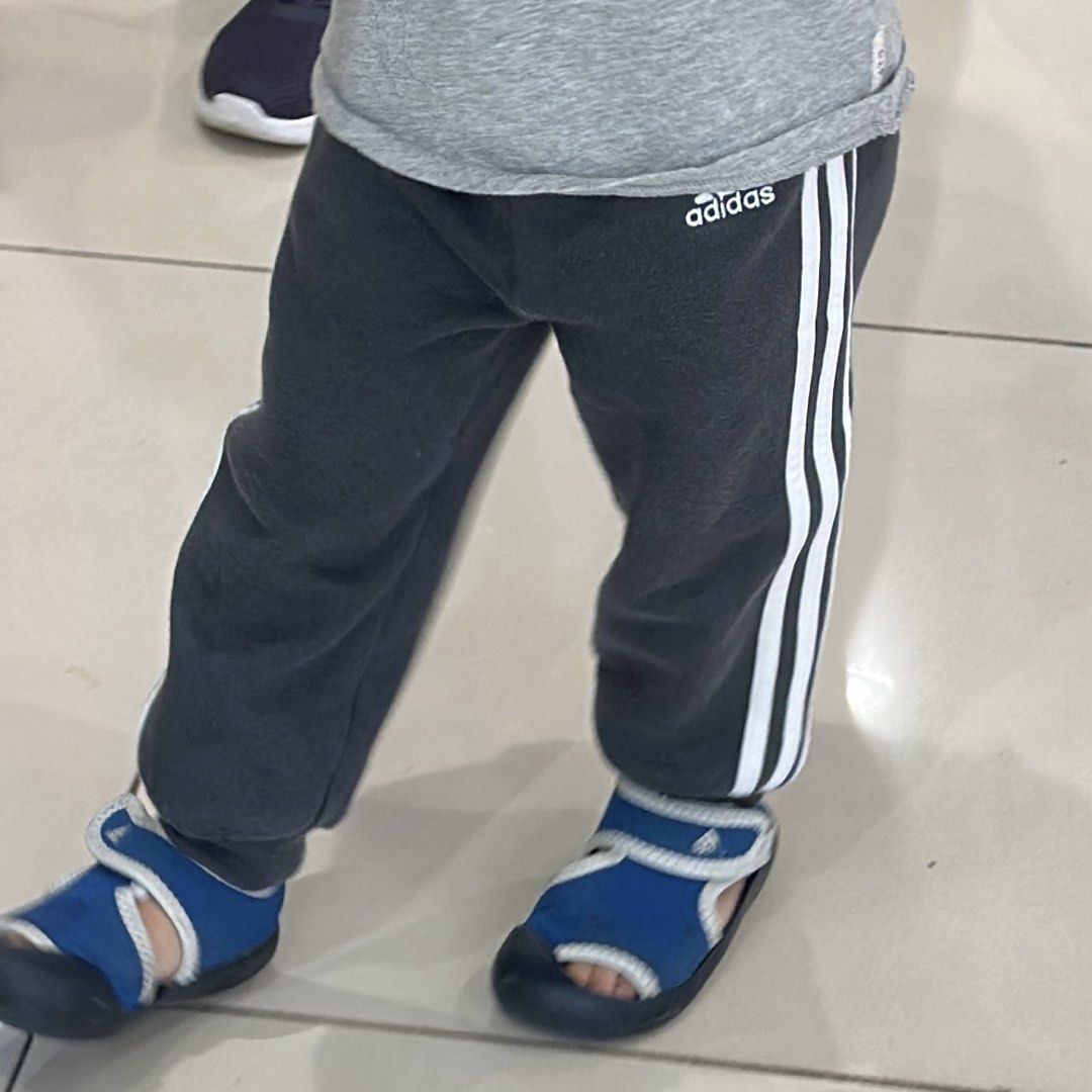 Adidas Toddler Track Pants Size 80 (Category: Babies & Kids Fashion) located in Angeles City. Submitted by gladnovic10 (Listing ID 1420321722, Image 2). Description: - Adidas Track Pants for Toddler - Color: Dark grey - Size: 80 - Features Adidas logo - With adjustable waist string - White stripes on sides - Made in Thailand - Material: 70% cotton, 30% polyester - Includes care label - Please manage your expectation. This is a preloved item..