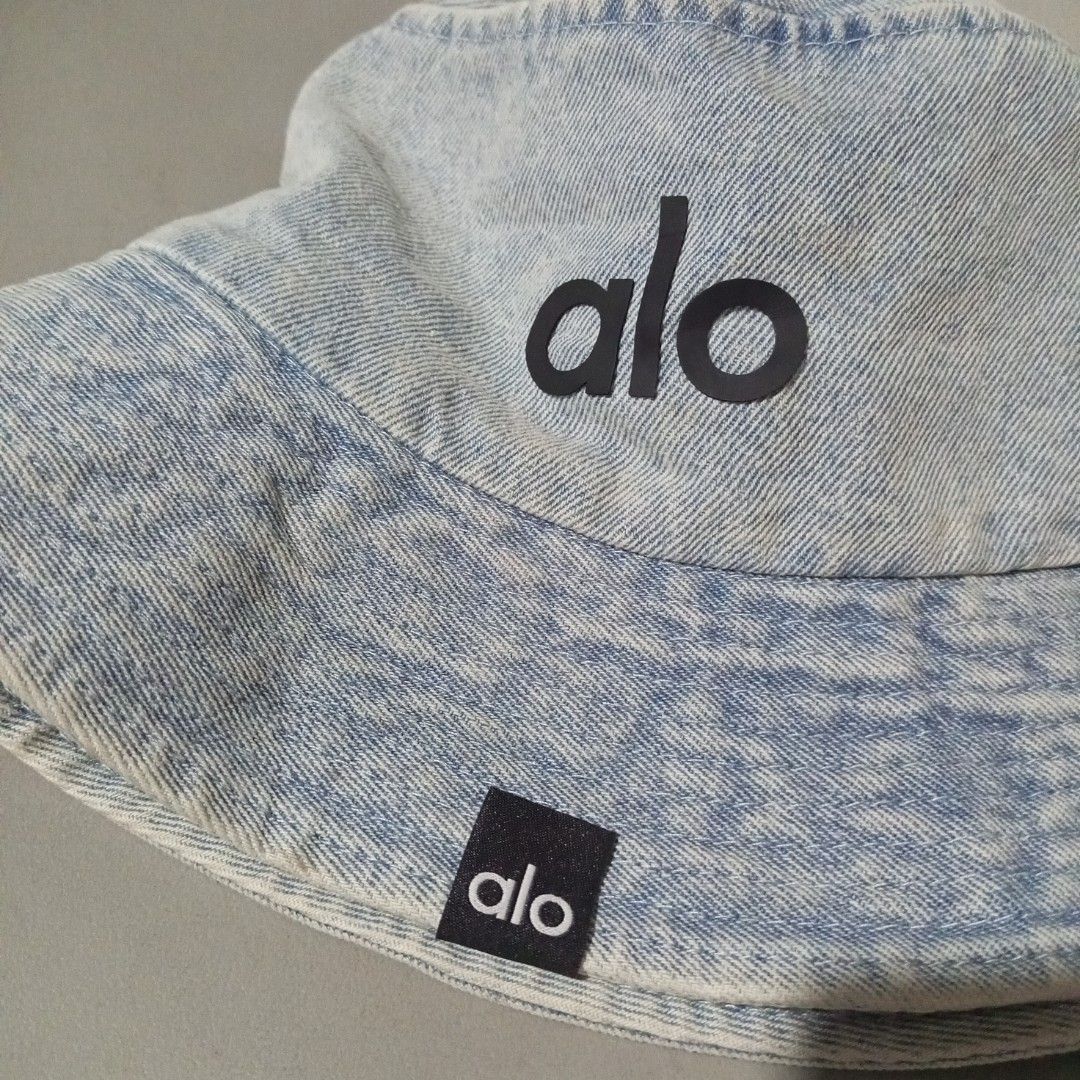 Alo Denim Bucket Hat (Category: Hats & Beanies) located in Sindangan. Submitted by mix_thrift0308 (Listing ID 1422025739, Image 3). Description: - Alo denim bucket hat - Light blue wash - Features the Alo logo - Black lining - Drawstring inside - Standard size - Suitable for casual wear.