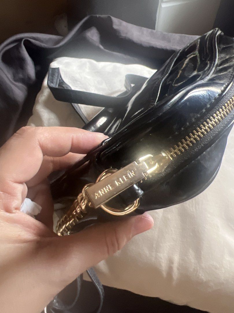Anne Klein Black Crossbody Bag (Category: Cross-body Bags) located in Taguig. Submitted by stuffitlikeitshot (Listing ID 1421956717, Image 3). Description: - Black Anne Klein crossbody bag - Gold-tone hardware - Front pocket with "AK" logo - Chain strap- adjustable - Zipper closure - Patent leather material - used a few times only.