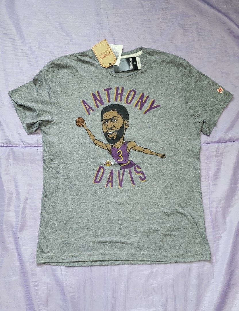 Anthony Davis Lakers Graphic Tee (Category: Tshirts & Polo Shirts ) located in Marikina City. Submitted by anbierose (Listing ID 1421969906, Image 1). Description: - Gray t-shirt with an Anthony Davis graphic. - Features "Anthony Davis" printed above the graphic. - Includes a small logo on the right sleeve. - Brand new with tag attached..