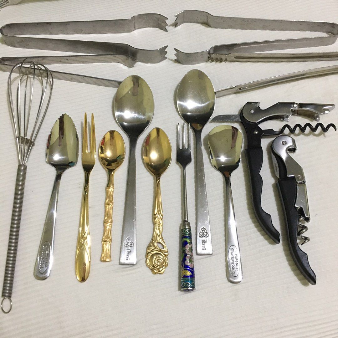 Assorted Kitchen Utensils and Glassware (Category: Other Kitchenware & Tableware) located in Makati City. Submitted by tasteofluxury (Listing ID 1422046916, Image 2). Description: Set includes two wine glasses, two glass baking dishes, various spoons, forks, and serving tongs. Also included are two corkscrews and a whisk. The spoons have different designs with brand, including a bamboo-style and a rose-detailed spoon. The set is perfect for servi