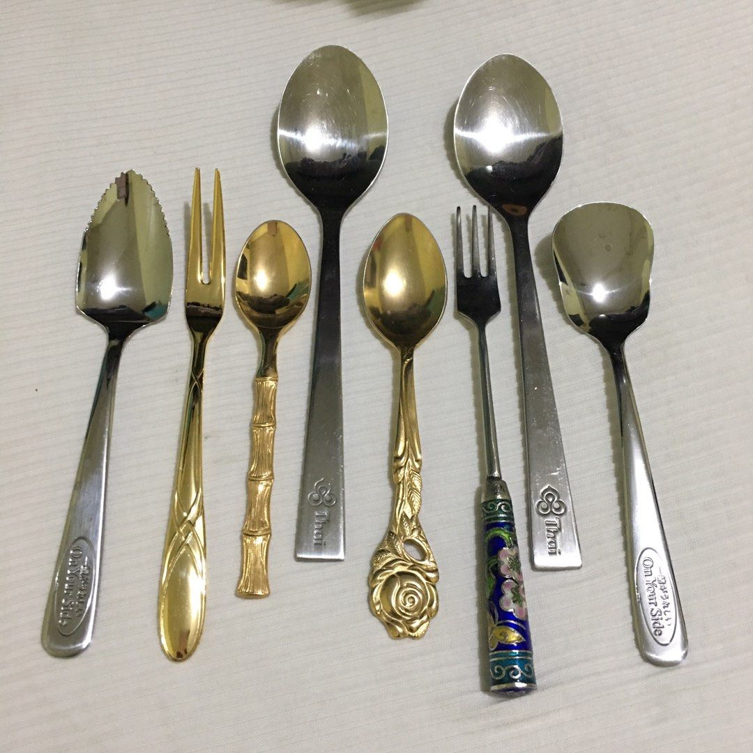 Assorted Kitchen Utensils and Glassware (Category: Other Kitchenware & Tableware) located in Makati City. Submitted by tasteofluxury (Listing ID 1422046916, Image 3). Description: Set includes two wine glasses, two glass baking dishes, various spoons, forks, and serving tongs. Also included are two corkscrews and a whisk. The spoons have different designs with brand, including a bamboo-style and a rose-detailed spoon. The set is perfect for servi