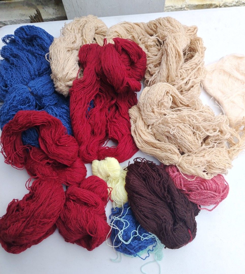 Assorted Yarn Skeins - Various Colors (Category: Craft Supplies & Tools) located in Manila. Submitted by kcfunkyfindz (Listing ID 1421952569, Image 1). Description: Assorted yarn skeins in various colors (red, blue, beige, yellow, purple). Ideal for knitting, crocheting, and crafts. Mixed textures and weights for diverse projects..