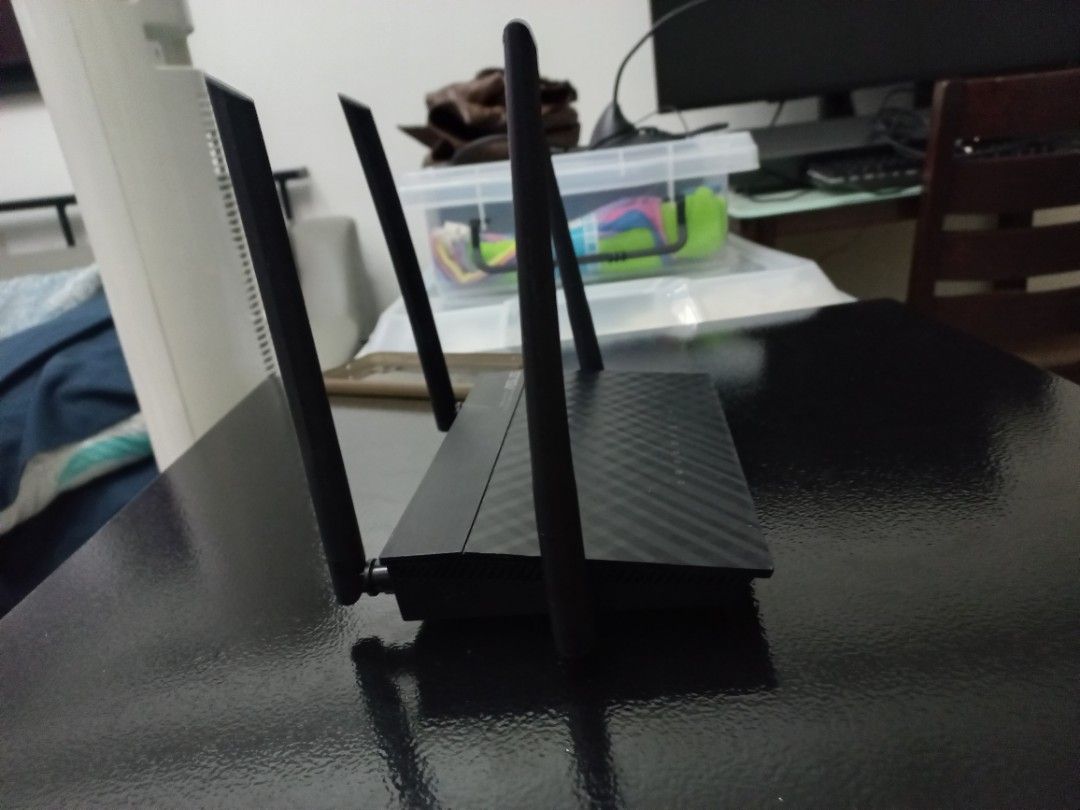 ASUS Router (Category: Networking) located in Makati City. Submitted by zencrystal-3de6cc (Listing ID 1422070514, Image 2). Description: ASUS black router with multiple antennas. Ideal for home or small office use. Provides reliable internet connectivity..
