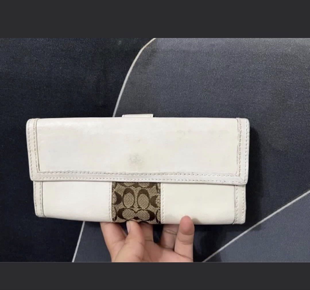 Authentic Coach Long Wallet (Category: Luxury Bags & Wallets) located in Caloocan City. Submitted by introvertshopper (Listing ID 1422035701, Image 2). Description: -authentic Coach long wallet - White exterior with brown monogram stripe - Multiple card slots and compartments - Snap closure with gold-tone Coach logo - Beige interior -No issue - Bought in Japan.