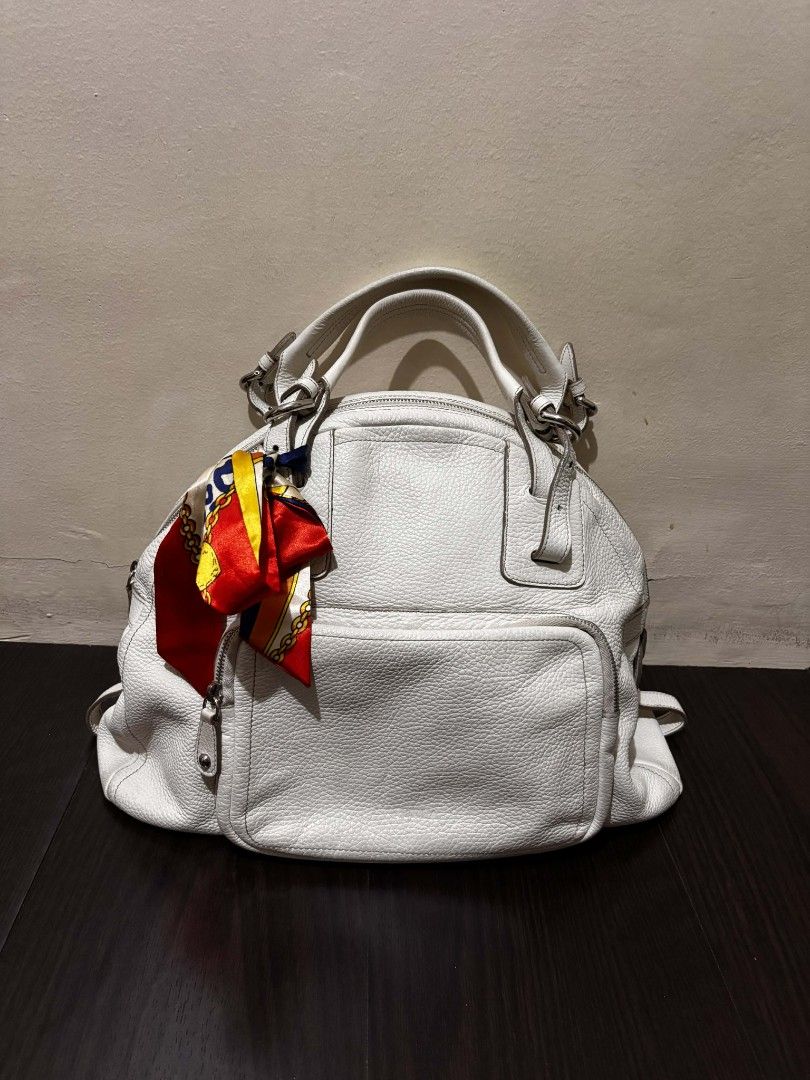 Authentic Furla White Leather Handbag (Category: Luxury Bags & Wallets) located in Cavite. Submitted by k_ssi (Listing ID 1422036301, Image 1). Description: - White leather handbag - Front pocket - Top handles - Genuine leather.