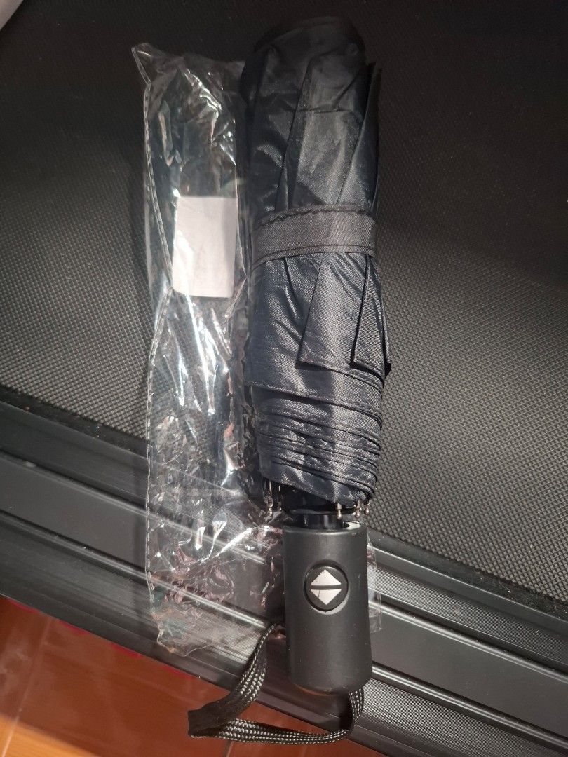 Automatic Foldable Umbrella - sold each (Category: Umbrellas) located in Quezon City. Submitted by an.marie (Listing ID 1421976200, Image 1). Description: Compact foldable umbrella. Easy to carry, with a black handle, button, and wrist strap. Comes in clear plastic packaging..