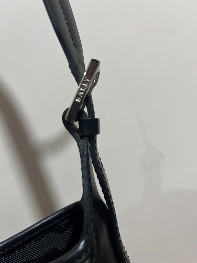 Bally Shoulder Bag (Category: Luxury Bags & Wallets) located in Tarlac. Submitted by jclections (Listing ID 1422056211, Image 3). Description: - Authentic Bally shoulder bag - Unique geometric pattern - Black leather trim and straps - Silver-tone buckle with Bally logo - Interior with zipper closure and Bally tag - Made in Italy - Spacious interior.