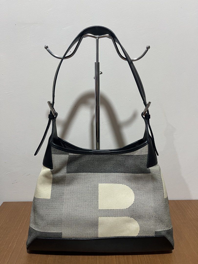 Bally Shoulder Bag (Category: Luxury Bags & Wallets) located in Tarlac. Submitted by jclections (Listing ID 1422056211, Image 1). Description: - Authentic Bally shoulder bag - Unique geometric pattern - Black leather trim and straps - Silver-tone buckle with Bally logo - Interior with zipper closure and Bally tag - Made in Italy - Spacious interior.