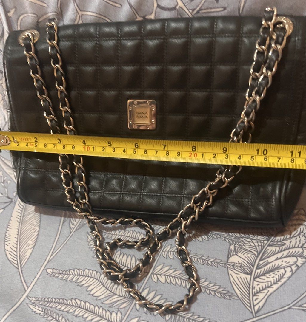 Bana bana Black Quilted Shoulder Bag (Category: Shoulder Bags) located in Manila. Submitted by beatep (Listing ID 1421984132, Image 2). Description: - convertible -Black quilted shoulder bag - Chain straps - Flap closure - Small metal logo - Zipper closure - Dimensions: 11" (L) x 8" (H) x 3" (W) Shipping shouldered by buyer.