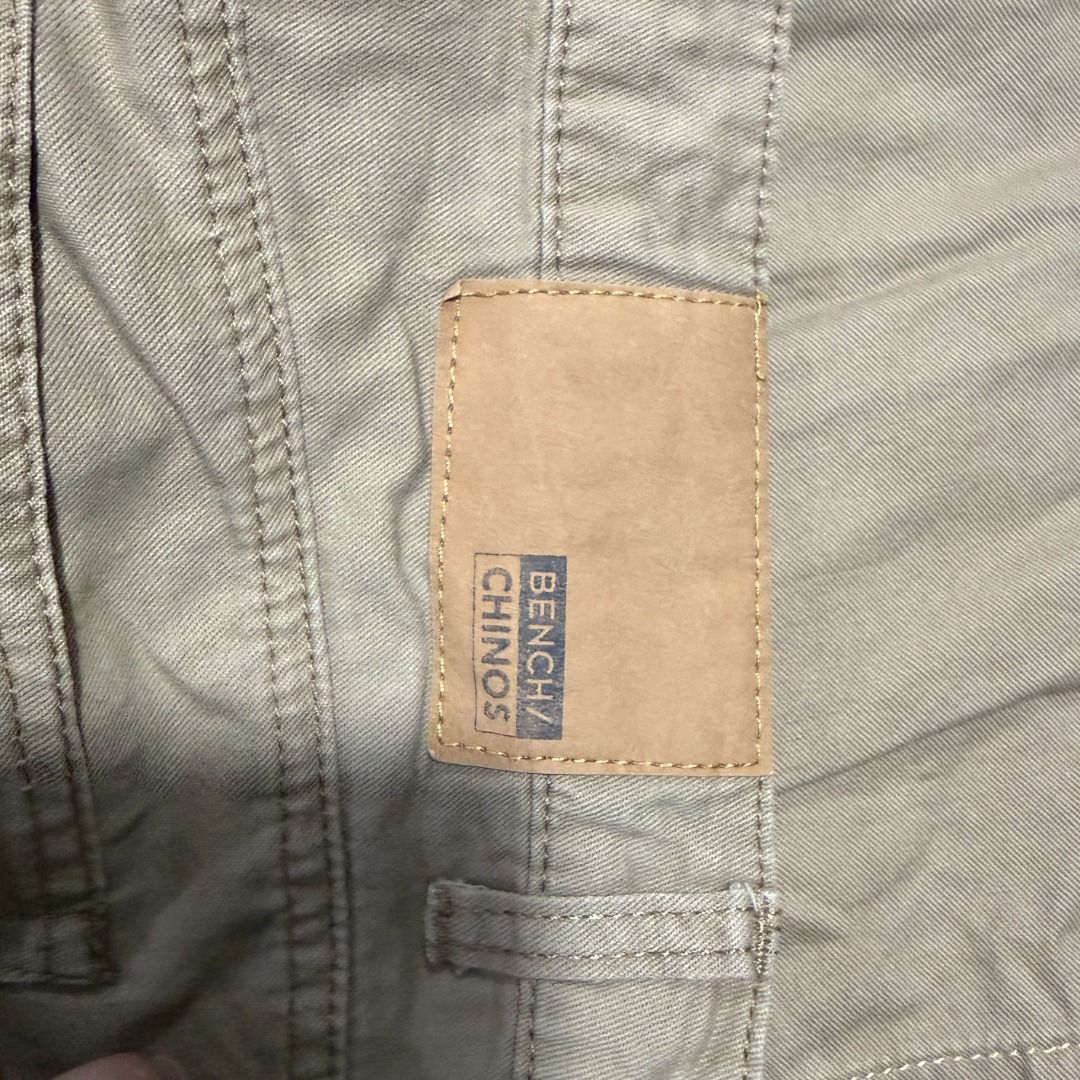 Bench Chinos Khaki Shorts - Size 30 (Category: Shorts) located in Cavite. Submitted by red.19 (Listing ID 1422036276, Image 3). Description: - Bench Chino Shorts - Color: Khaki - Closure: Button and zipper - Pockets: Two front, two back - Inseam: Approximately 8 inches - Condition: Good, with some blue stains on the front..