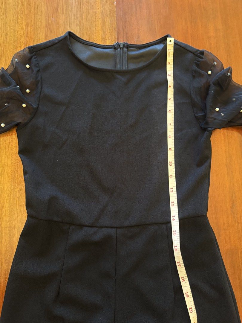 Black Jumpsuit with Pearl Sleeves (Category: Jumpsuits) located in Mandaue City. Submitted by marginiz (Listing ID 1421957900, Image 2). Description: Elegant black jumpsuit featuring a round neckline and long sleeves with pearl embellishments. The jumpsuit has a fitted bodice and straight-leg pants. It includes a zipper closure at the back. The sleeves are made of sheer fabric, adding a touch of sophistication. Note: tag removed for comfort.