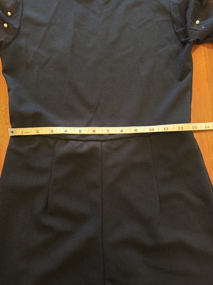 Black Jumpsuit with Pearl Sleeves (Category: Jumpsuits) located in Mandaue City. Submitted by marginiz (Listing ID 1421957900, Image 3). Description: Elegant black jumpsuit featuring a round neckline and long sleeves with pearl embellishments. The jumpsuit has a fitted bodice and straight-leg pants. It includes a zipper closure at the back. The sleeves are made of sheer fabric, adding a touch of sophistication. Note: tag removed for comfort.