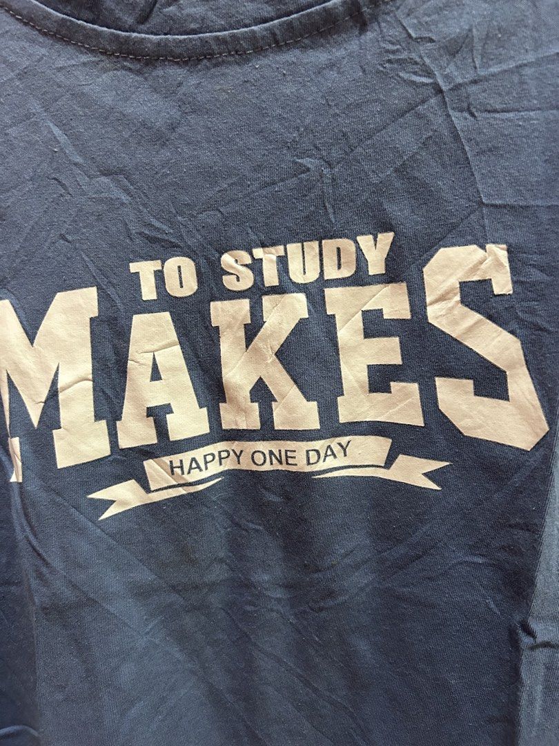 Blue Graphic T-shirt - Size S (Category: Tshirts & Polo Shirts ) located in Cainta. Submitted by hersheys17 (Listing ID 1422014278, Image 2). Description: - Blue t-shirt - Graphic print: "TO STUDY MAKES HAPPY ONE DAY" - Size: S - Features: Round neckline, short sleeves - Fabric: Lightweight.