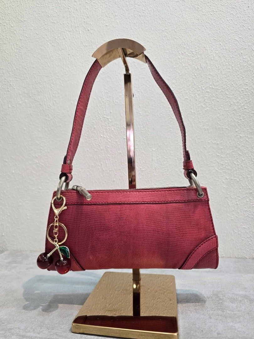 Burberry Pink Lizard Embossed Leather Shoulder Bag Authentic💯💯 (Category: Luxury Bags & Wallets) located in Davao. Submitted by SecondhandItems97 (Listing ID 1422021347, Image 1). Description: - Small bag in vibrant pink lizard-embossed leather - Small size - Includes generic dustbag only - Features a top handle - Silver-tone zipper closure - Includes a cherry charm - Compact and ideal for everyday use - Stylish and functional design.