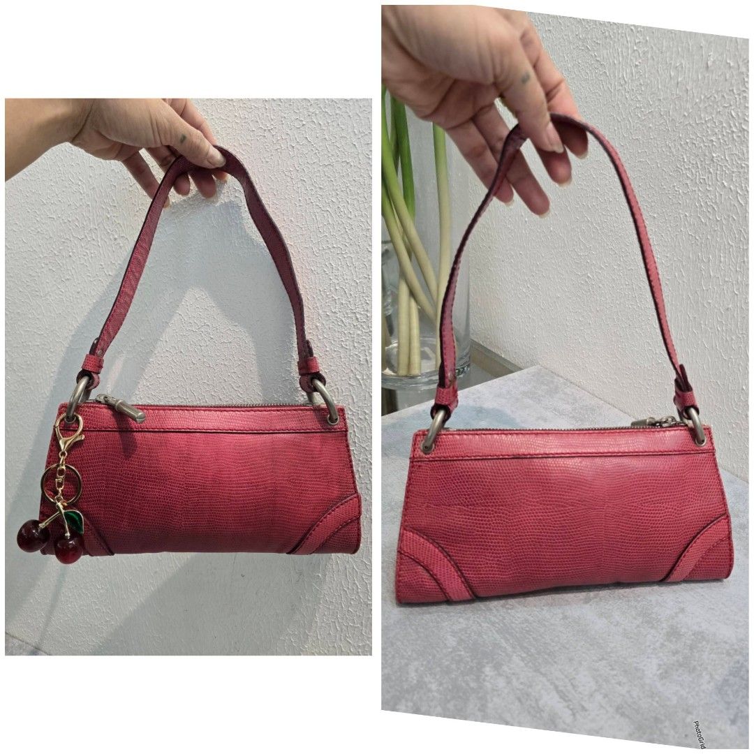 Burberry Pink Lizard Embossed Leather Shoulder Bag Authentic💯💯 (Category: Luxury Bags & Wallets) located in Davao. Submitted by SecondhandItems97 (Listing ID 1422021347, Image 3). Description: - Small bag in vibrant pink lizard-embossed leather - Small size - Includes generic dustbag only - Features a top handle - Silver-tone zipper closure - Includes a cherry charm - Compact and ideal for everyday use - Stylish and functional design.