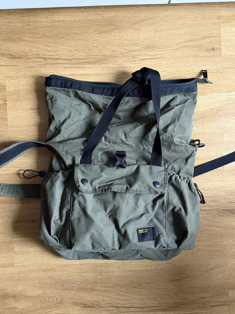 Carhartt Utility Tote Bag (Category: Sling Bags) located in Manila. Submitted by raffcol (Listing ID 1422002484, Image 3). Description: - Carhartt olive green tote bag - bought at Carhartt, Power Plant Mall - Roll-top closure - Front pocket - Secure buckle closure - Perfect for everyday use - negotiable.