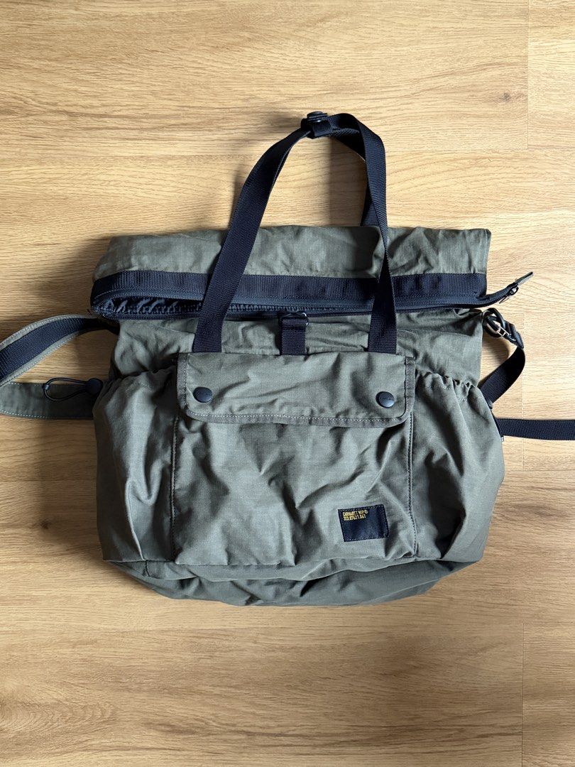 Carhartt Utility Tote Bag (Category: Sling Bags) located in Manila. Submitted by raffcol (Listing ID 1422002484, Image 2). Description: - Carhartt olive green tote bag - bought at Carhartt, Power Plant Mall - Roll-top closure - Front pocket - Secure buckle closure - Perfect for everyday use - negotiable.