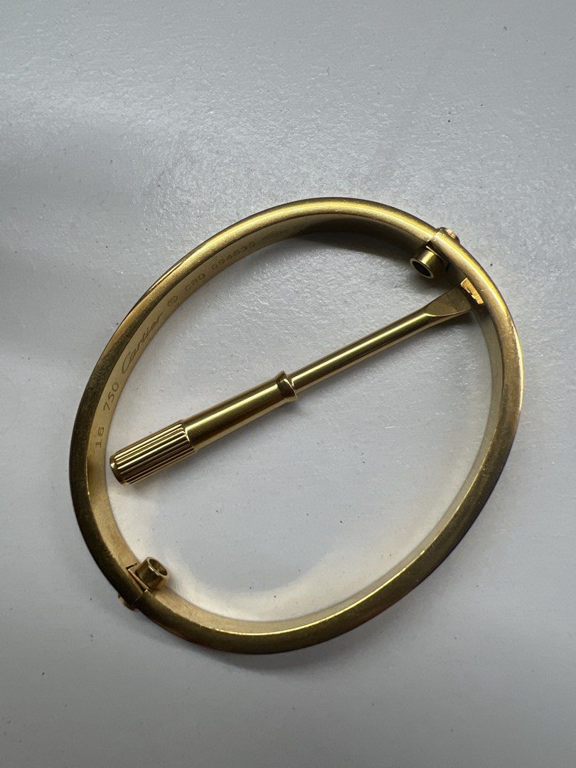 Cartier Love Bracelet 16 (Category: Bracelets) located in Manila. Submitted by bluearrow14 (Listing ID 1422053526, Image 3). Description: - Cartier Love Bracelet - Iconic screw design - Size 16 - Includes screwdriver - Marked: "750 Cartier" and serial number CRD 094835 Minimal scratches.