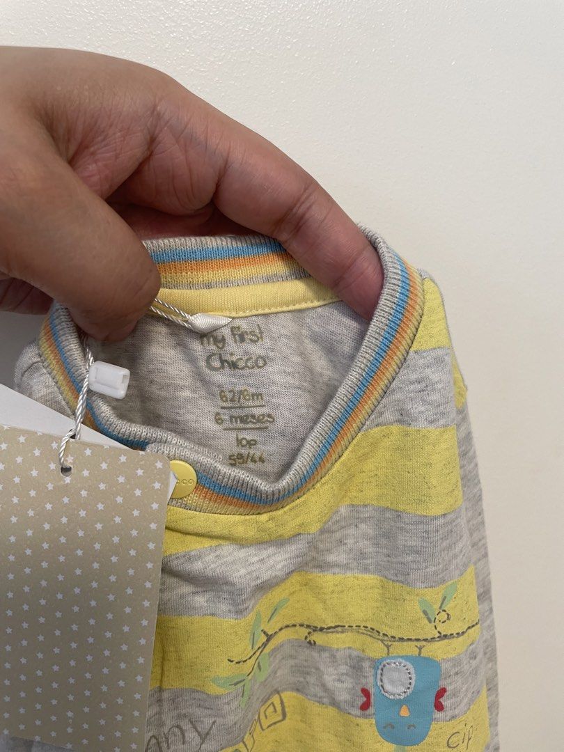 Chicco Baby Onesie 6 Months (Category: Babies & Kids Fashion) located in Mandaluyong City. Submitted by mclldmrl (Listing ID 1421970416, Image 2). Description: Adorable Chicco baby onesie, size 6 months. Features a cute elephant and hippo design with yellow and gray stripes. Includes snap closures for easy dressing. Made from soft fabric, perfect for your little one. New with tags..