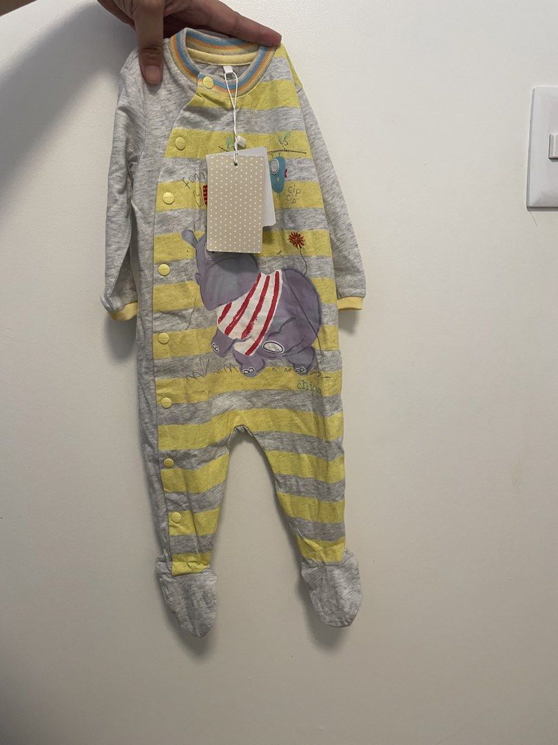 Chicco Baby Onesie 6 Months (Category: Babies & Kids Fashion) located in Mandaluyong City. Submitted by mclldmrl (Listing ID 1421970416, Image 1). Description: Adorable Chicco baby onesie, size 6 months. Features a cute elephant and hippo design with yellow and gray stripes. Includes snap closures for easy dressing. Made from soft fabric, perfect for your little one. New with tags..