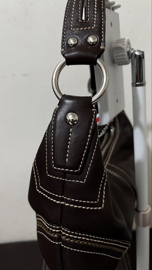 Coach Soho Hobo bag (Open for LAYAWAY) (Category: Luxury Bags & Wallets) located in Bulacan. Submitted by rds.declutter (Listing ID 1421962217, Image 3). Description: - Authentic Coach handbag - Coach Brown Leather Hobo Bag - Interior Coach label with serial number A0769-10574 - Spacious interior Makinis na malinis pa labas at loob, sobrang cute and ganda. Masarap i-touch kasi original leather. Pwedeng pwede sa maselan at maarte, no flaws..
