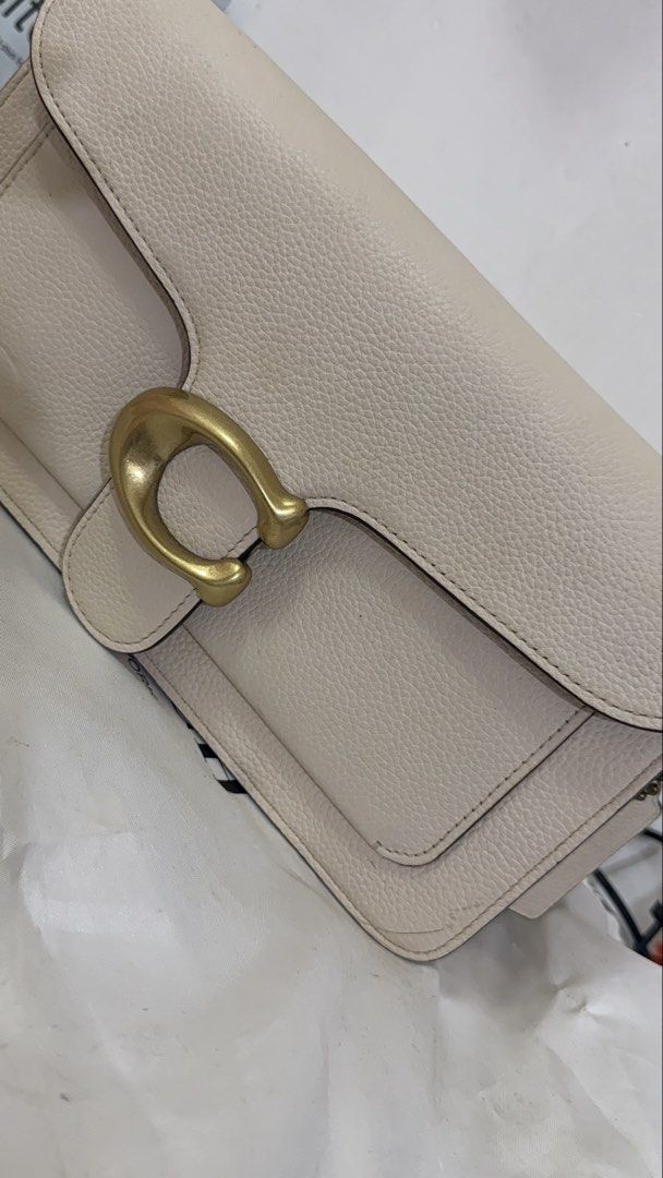 Coach Tabby Shoulder Bag (Category: Luxury Bags & Wallets) located in Zamboanga. Submitted by princessdi09838 (Listing ID 1421971750, Image 2). Description: - Coach Tabby - Light cream color - Detachable shoulder strap - Includes dust bag - Made of leather -Needs Cleaning -Issues: Small dent infront & scratches inside magnetic lock .