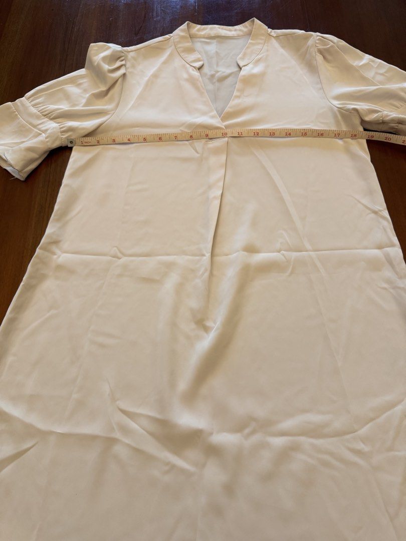 Cream-colored Dress with Flared Sleeves (Category: Dresses) located in Mandaue City. Submitted by marginiz (Listing ID 1421955169, Image 3). Description: - Cream-colored dress - V-neckline - Flared sleeves - Smooth, flowing fabric - Length: 35 inches - Bust: 20 inches (across) - Simple, elegant design Note: tag removed for comfort.