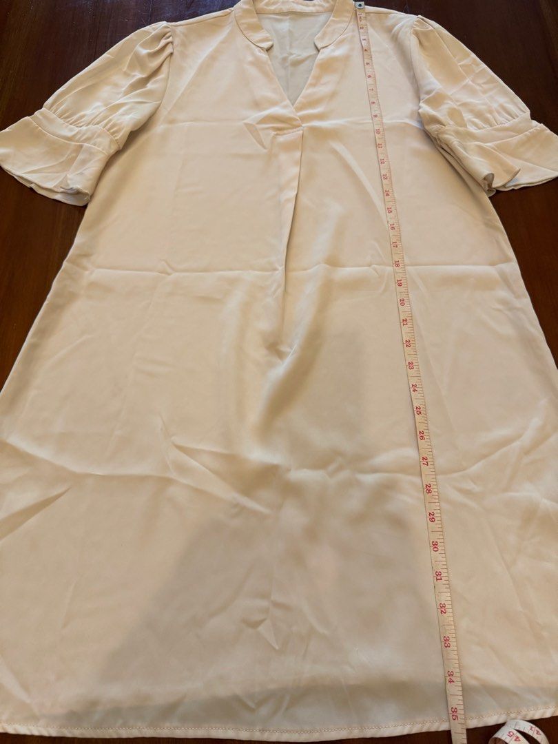 Cream-colored Dress with Flared Sleeves (Category: Dresses) located in Mandaue City. Submitted by marginiz (Listing ID 1421955169, Image 2). Description: - Cream-colored dress - V-neckline - Flared sleeves - Smooth, flowing fabric - Length: 35 inches - Bust: 20 inches (across) - Simple, elegant design Note: tag removed for comfort.