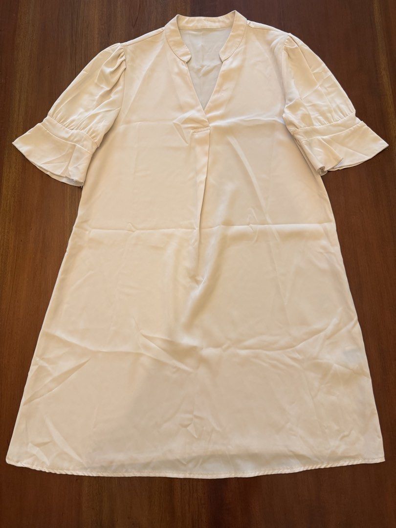Cream-colored Dress with Flared Sleeves (Category: Dresses) located in Mandaue City. Submitted by marginiz (Listing ID 1421955169, Image 1). Description: - Cream-colored dress - V-neckline - Flared sleeves - Smooth, flowing fabric - Length: 35 inches - Bust: 20 inches (across) - Simple, elegant design Note: tag removed for comfort.