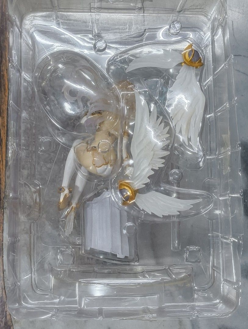 Cyberdimension Neptune Black Heart Figure (Category: Figurines & Statues) located in Manila. Submitted by azerrez (Listing ID 1422062440, Image 3). Description: Figure features Black Heart from Cyberdimension Neptune. It is a 1/7 scale PVC figure. The figure is in its original packaging. The figure is of Black Heart in a seated pose with wings. The box art shows the figure from multiple angles. The figure has white hair and a white outfit with go