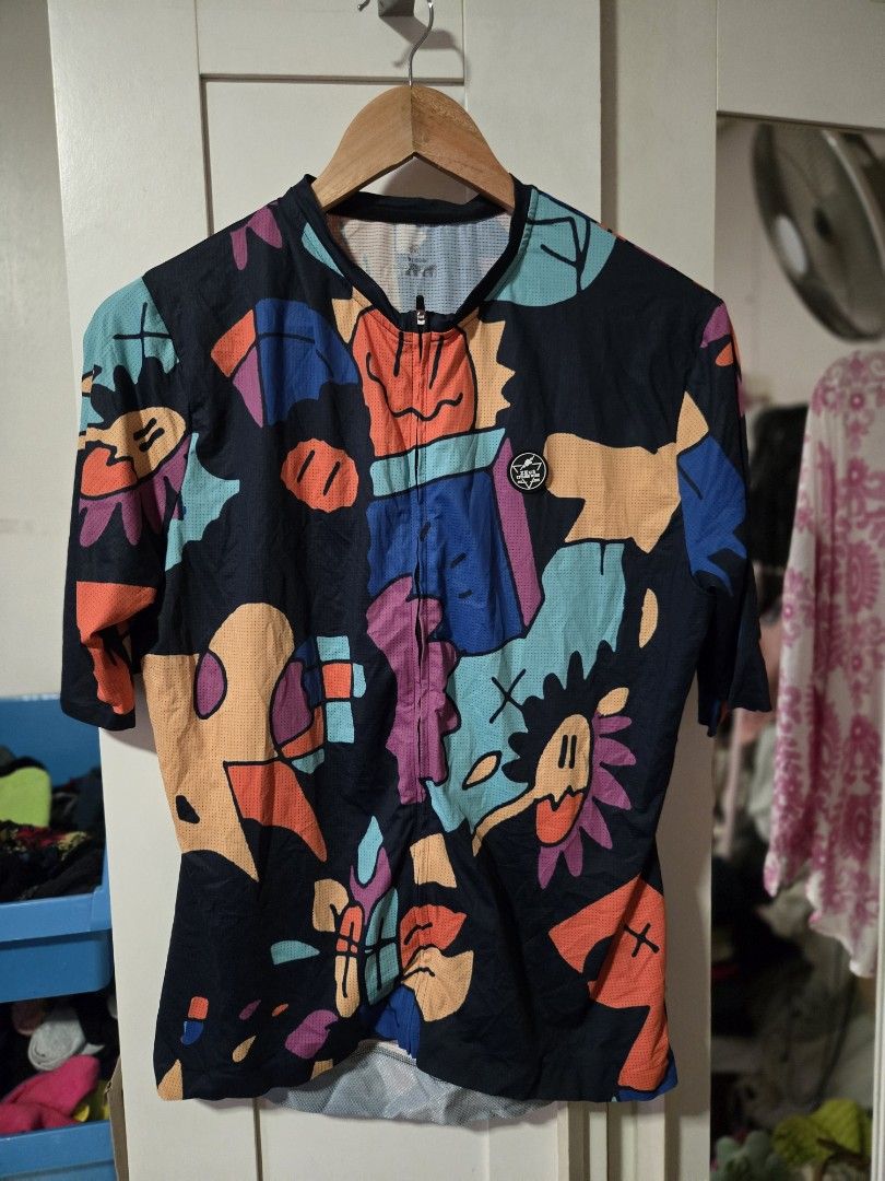Cycling Jersey - Colorful Design (Category: Activewear) located in Quezon City. Submitted by ddlry (Listing ID 1422005175, Image 1). Description: - Unique cycling jersey with an abstract design - Full-length zipper for ventilation - Comfortable crew neck - Long sleeves for sun protection - Made from breathable, athletic material - Eye-catching design with various shapes and colors.
