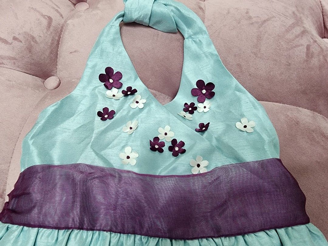 Danielle Halter Dress - Size 4 (Category: Babies & Kids Fashion) located in Mandaluyong City. Submitted by peqxy (Listing ID 1422027479, Image 2). Description: Preloved but in Excellent condition! DANIEILLE FLOWER APPLIQUE HALTER DRESS - Light blue halter dress - Purple waistband - Flower details on bodice - Tulle lining for volume Size: 4 Color: Aqua Blue with Purple Ribbon Belt Price: P175 Very pretty for your little girl.
