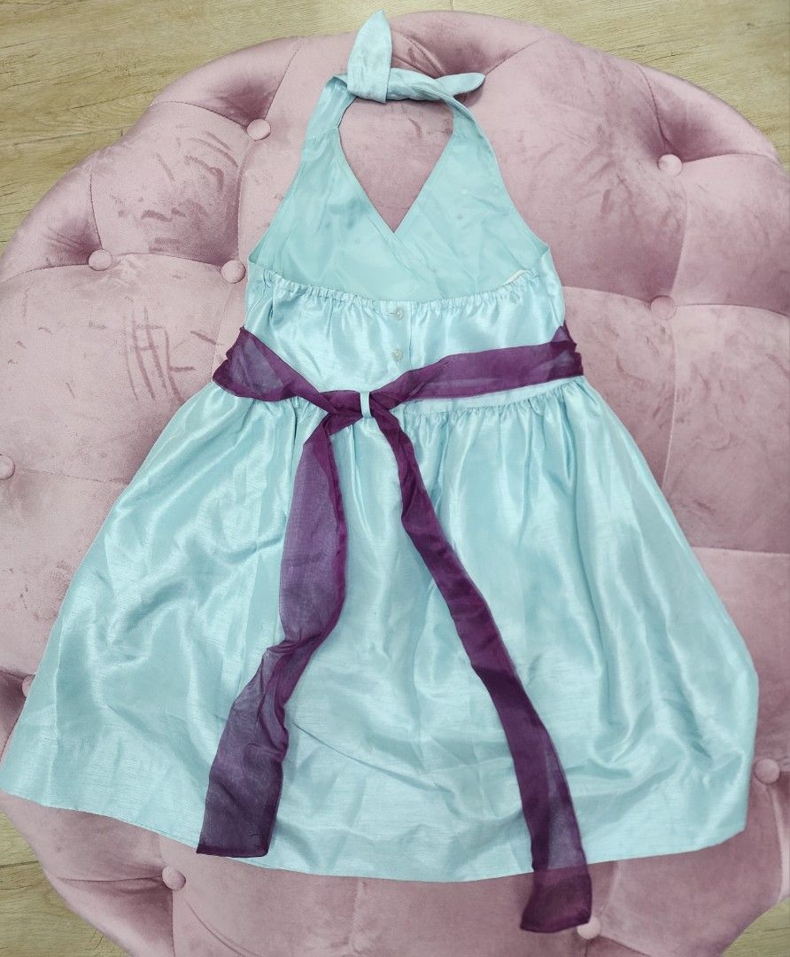 Danielle Halter Dress - Size 4 (Category: Babies & Kids Fashion) located in Mandaluyong City. Submitted by peqxy (Listing ID 1422027479, Image 3). Description: Preloved but in Excellent condition! DANIEILLE FLOWER APPLIQUE HALTER DRESS - Light blue halter dress - Purple waistband - Flower details on bodice - Tulle lining for volume Size: 4 Color: Aqua Blue with Purple Ribbon Belt Price: P175 Very pretty for your little girl.